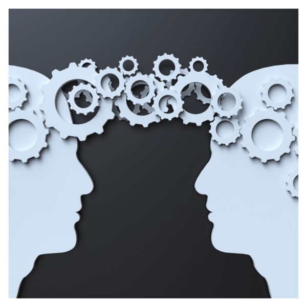 Gears connecting two silhouettes, representing idea exchange